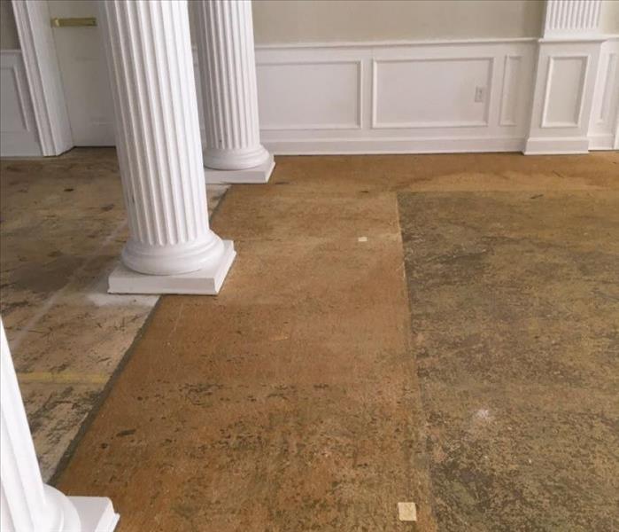 Hallway with columns and an exposed subfloor