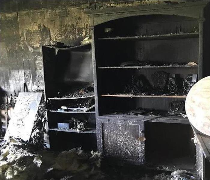 Fire damage to furniture in a room. 