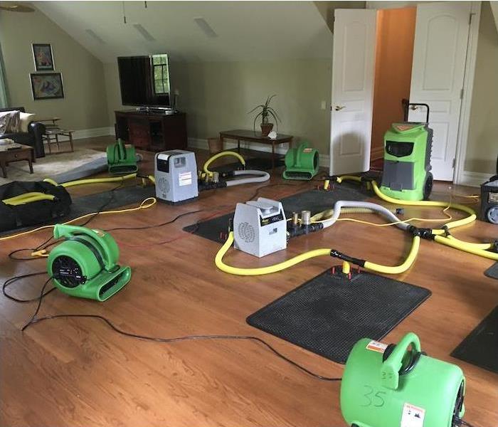 Equipment and drying mats on a water damaged floor